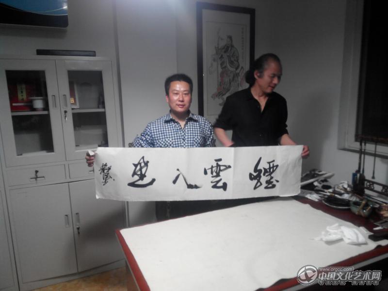国画家胡广宇与画虎明家崔静海老师合影