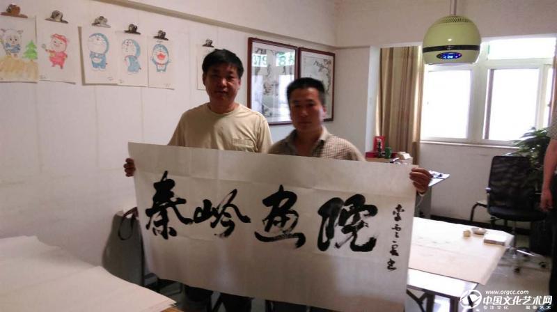 国画家胡广宇与李云良老师合影